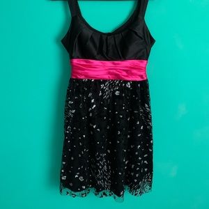 Party dress for any occasion. Cheetah print bottom, hot pink bow, low cut.